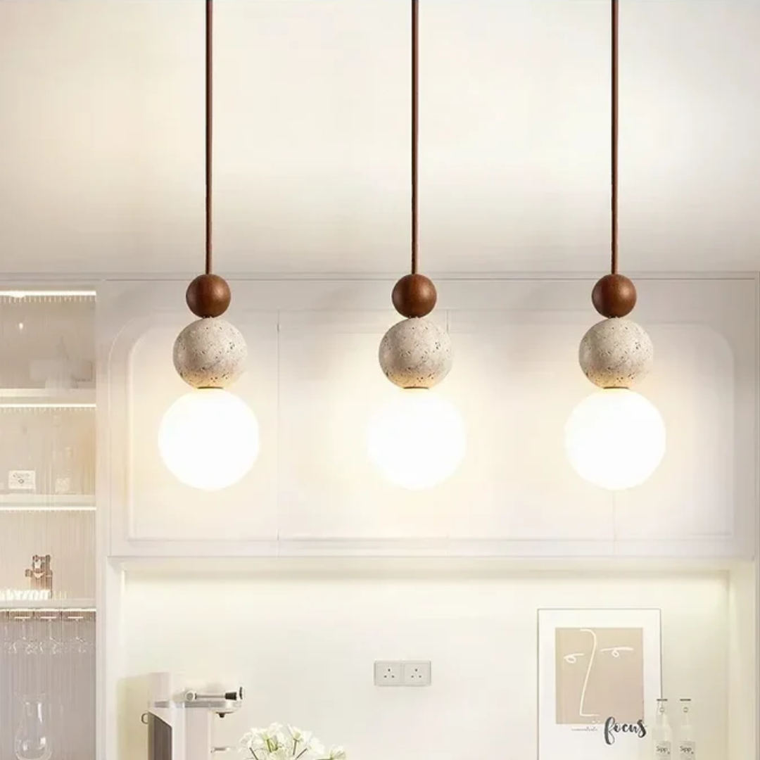 Natural mahogany accent on a stylish travertine pendant light for home decor
