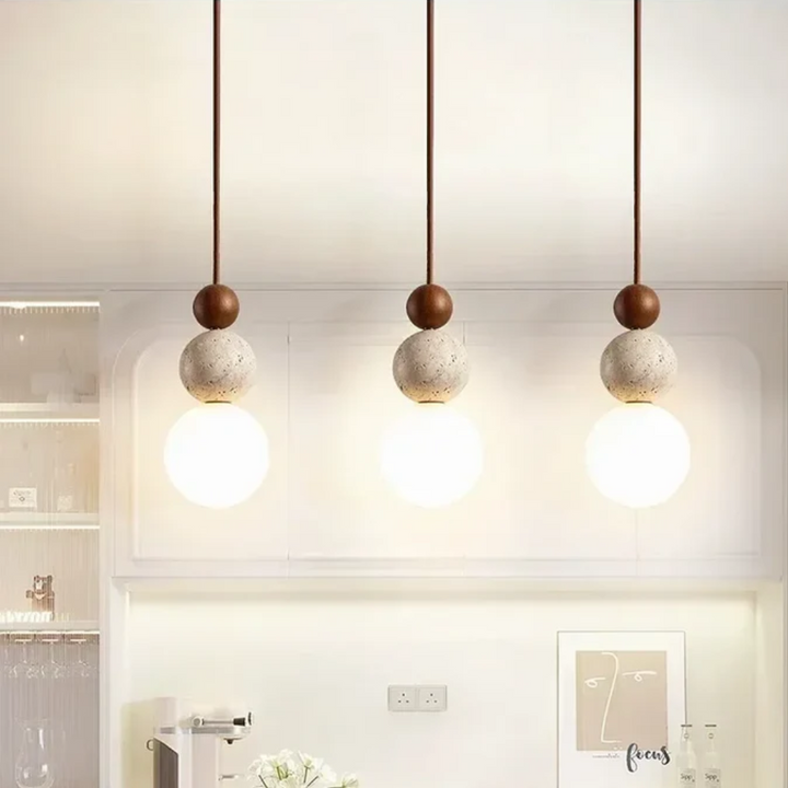 Natural mahogany accent on a stylish travertine pendant light for home decor