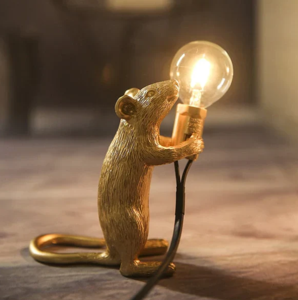 Charming gold mouse table lamp with white shade, perfect accent light for whimsical home decor.