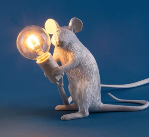 Charming gold mouse bedside lamp with white shade, a whimsical animal accent light for unique home decor.