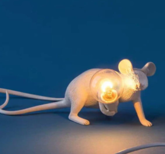 Unique gold mouse table lamp with white shade, a whimsical animal accent light perfect for any desk or shelf.