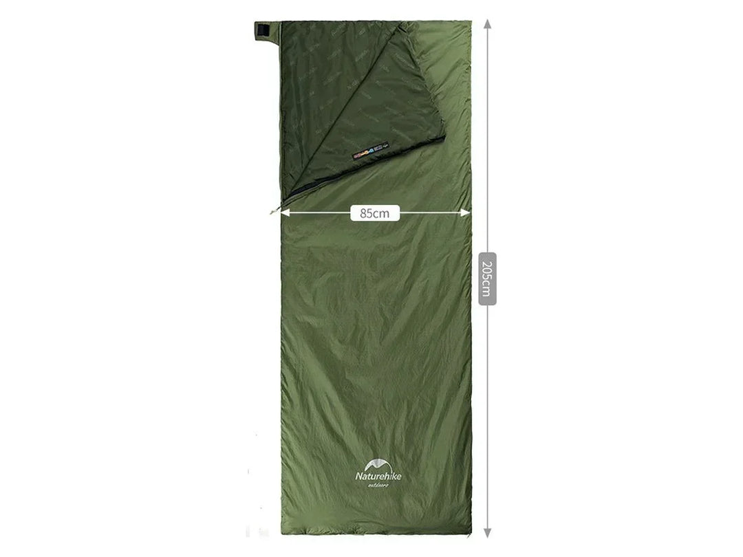 Green compact sleeping bag for camping. Lightweight, warm, and portable for outdoor adventures & travel.