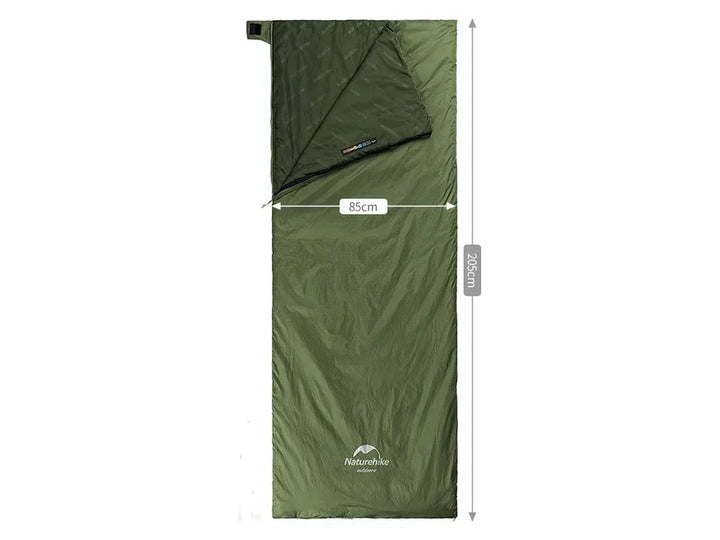 Green compact sleeping bag for camping. Lightweight, warm, and portable for outdoor adventures & travel.