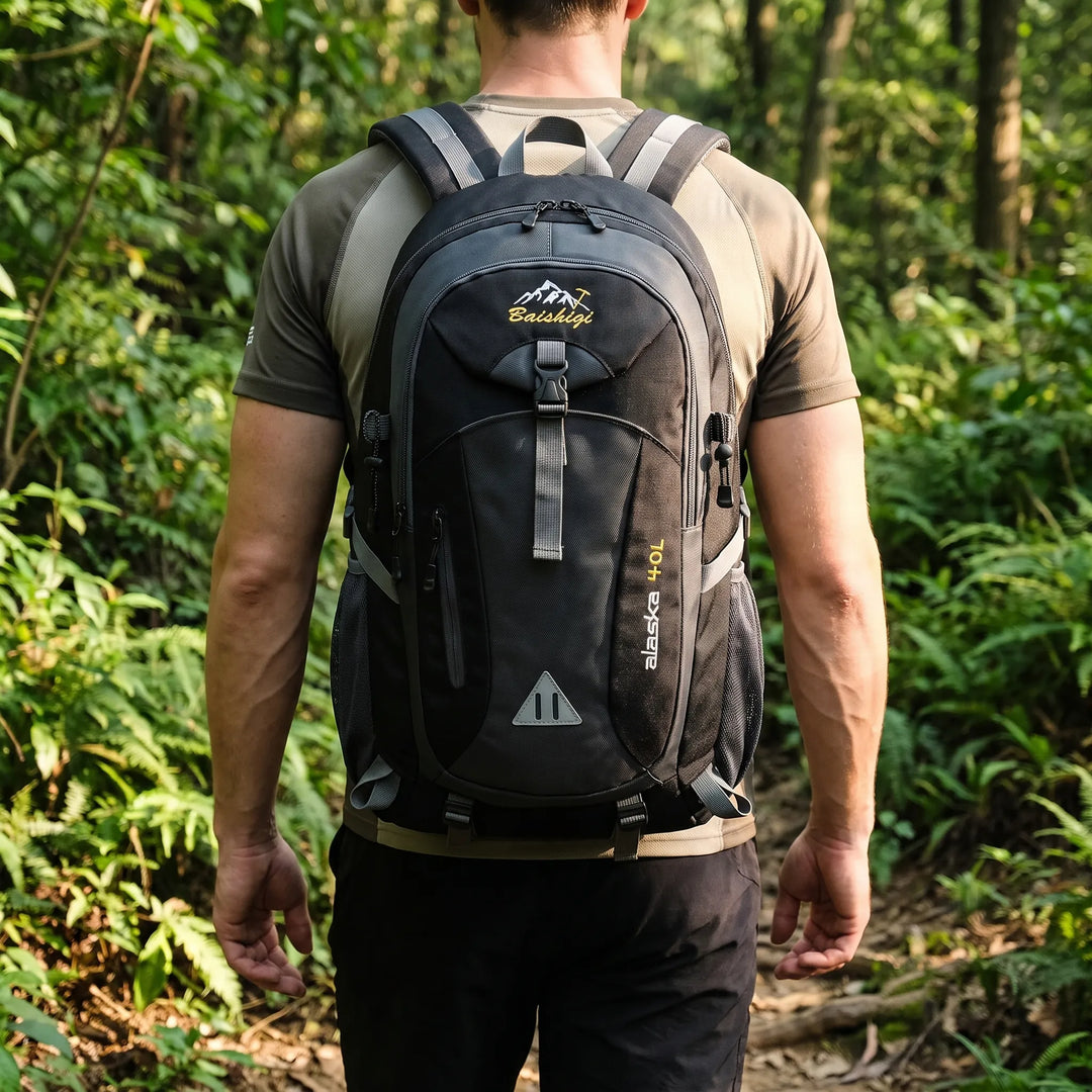 Practical unisex travel and hiking backpack featuring multiple organized compartments and durable nylon.