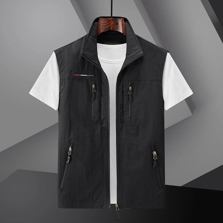 Lightweight men's summer travel vest with multiple pockets. Ideal for outdoor adventures & hiking.
