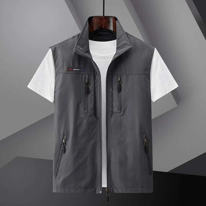 Sleeveless men's outdoor utility vest. Multi-pocket design, perfect lightweight gear for fishing & hiking.
