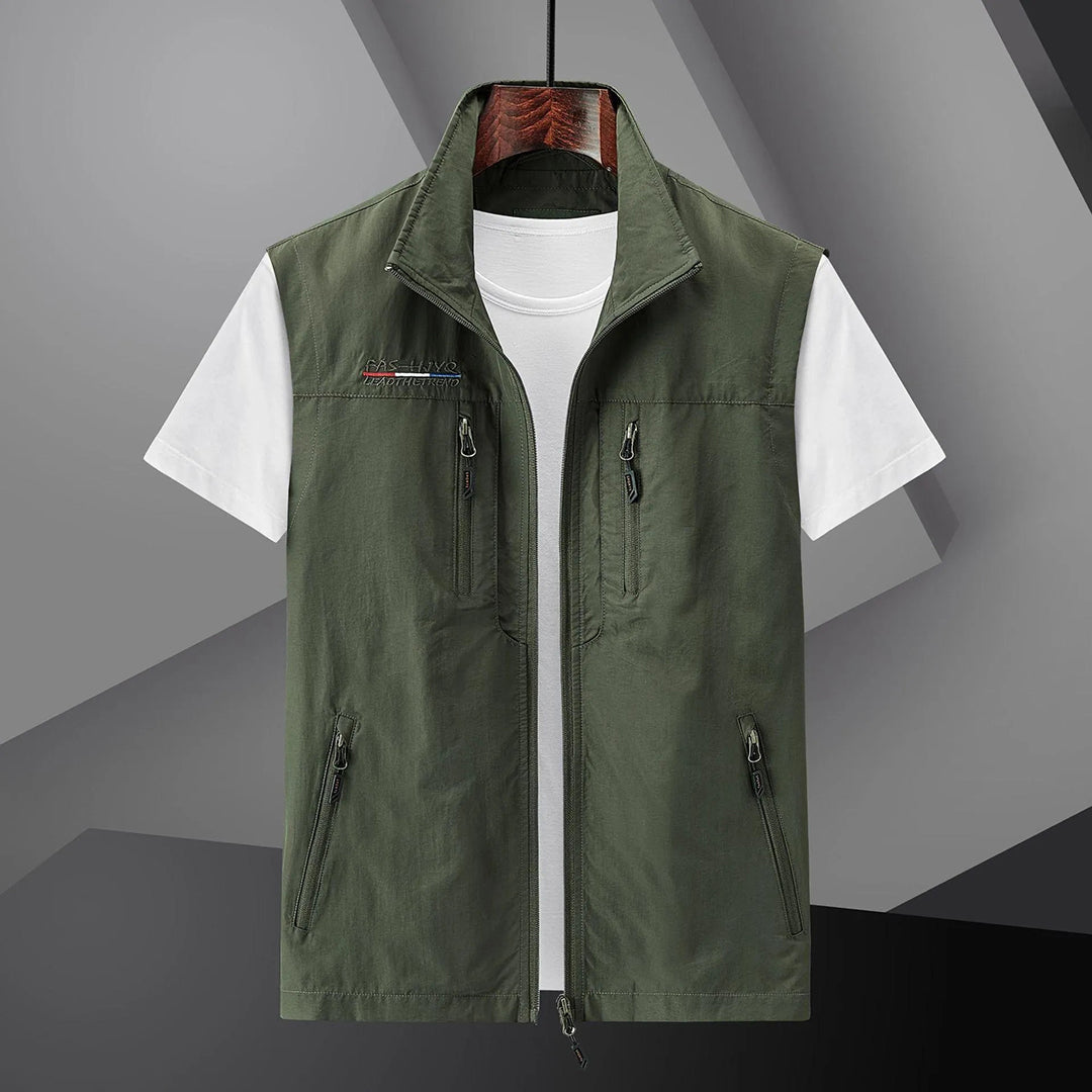 Durable men's outdoor utility vest. Lightweight, multi-pocket design for comfortable summer travel & adventure.
