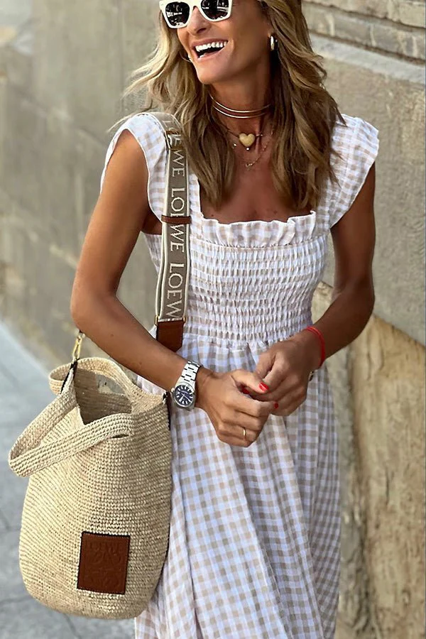 Elegant women's long maxi dress with a classic checkered pattern, perfect for a sophisticated fashion look.