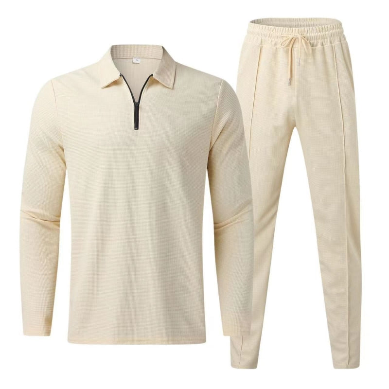 Fashionable men's quarter zip polo top, part of a versatile two-piece tracksuit set.