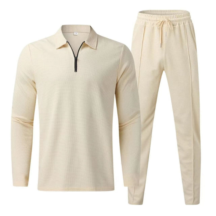 Fashionable men's quarter zip polo top, part of a versatile two-piece tracksuit set.