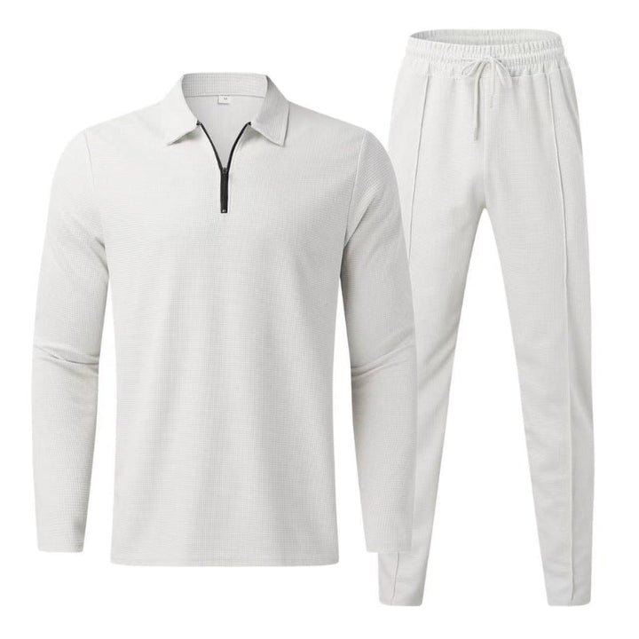 Complete men's fashion quarter zip polo and jogger pants tracksuit, offering style and comfort.