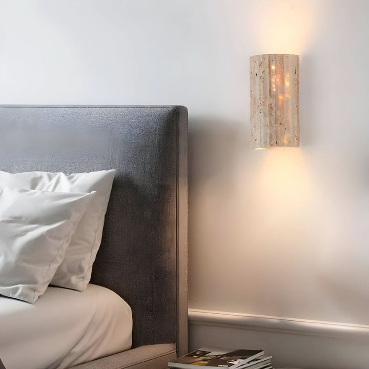 Textured natural stone LED wall sconce, elegant and energy-efficient modern wall light for stylish interiors.