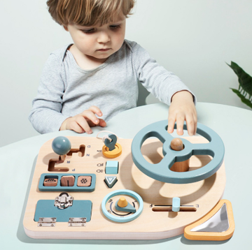 Montessori wooden play steering wheel for toddlers, encouraging fine motor skills & imaginative car play.