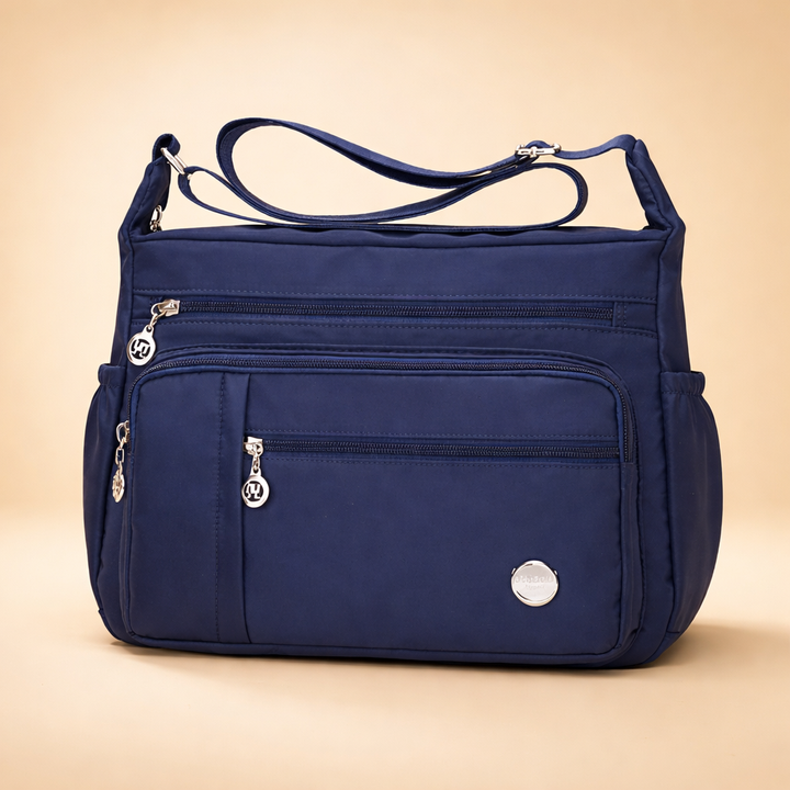 Multi-pocket women's travel handbag, ideal for organizing everyday essentials, secure hands-free style with adjustable strap.