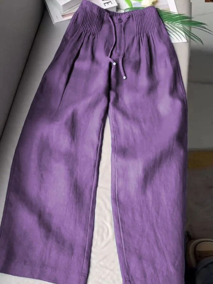 Boho chic women's wide leg pants with drawstring waist, offering a comfortable, flowy silhouette.