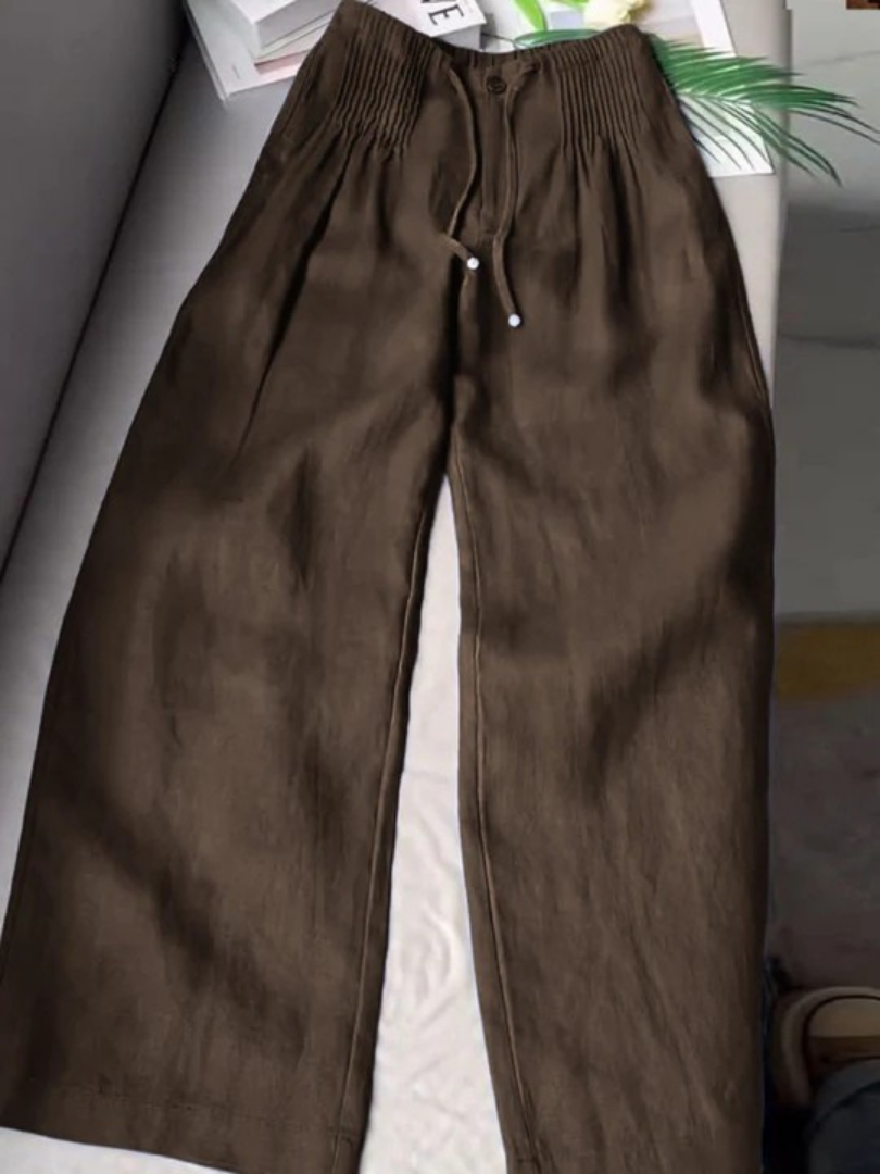 Close-up of comfortable women's wide leg drawstring pants, showcasing relaxed fit & breathable fabric.