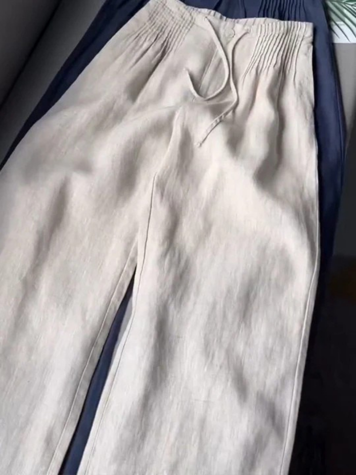 Woman wearing comfortable women's wide leg drawstring pants, ideal for relaxed summer and casual outfits.