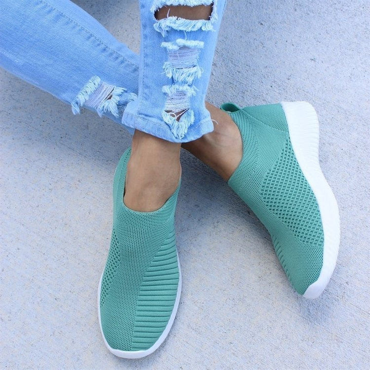 Breathable women's slip-on sneakers, ideal for spring, summer, or fall style. Comfortable & lightweight.