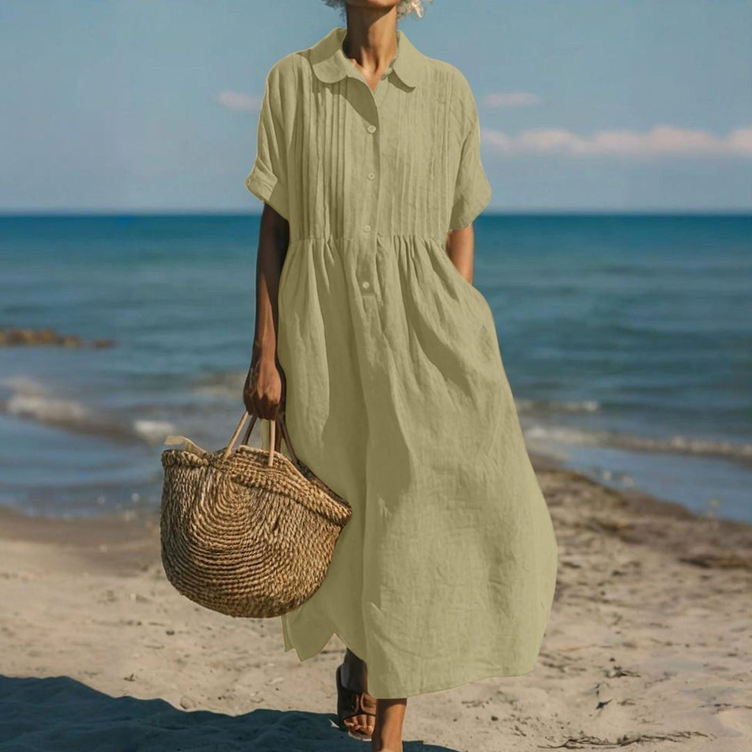 Women's casual midi shirt dress, collared, full button front, offering effortless summer style.