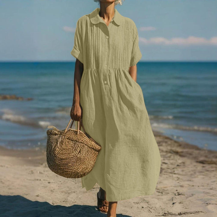 Women's casual midi shirt dress, collared, full button front, offering effortless summer style.