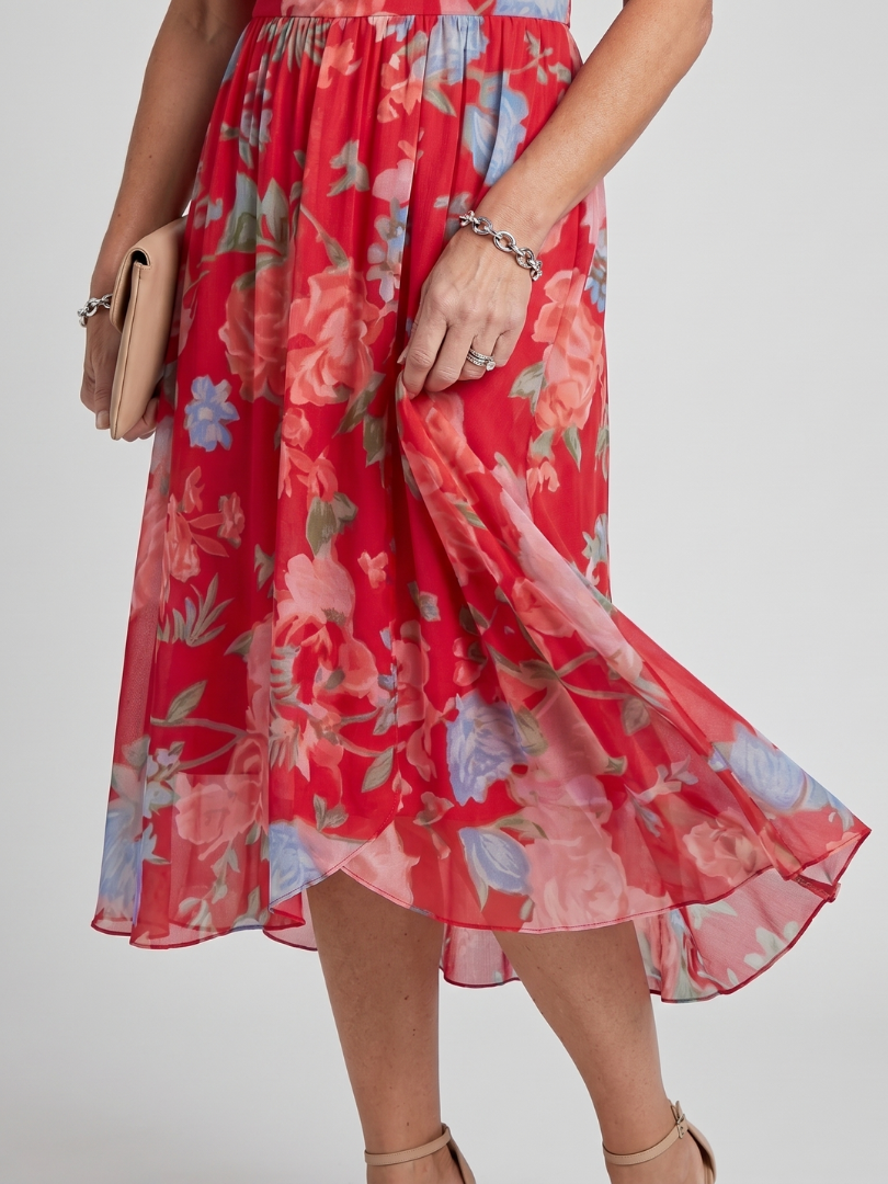 Women's wedding guest floral wrap midi dress, flutter sleeves, elegant with asymmetric hem.