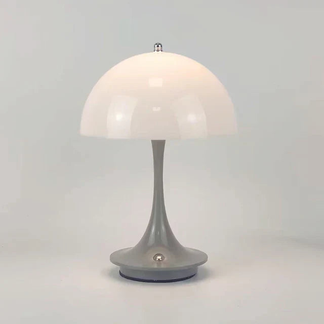 Designer cordless table lamp, providing warm LED light & stylish home decor.