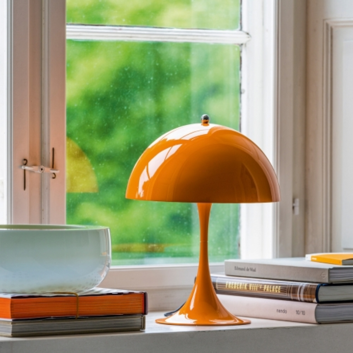 Stylish portable LED lamp with dimmable light, great for reading or ambiance.
