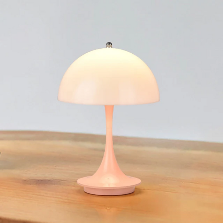 Rechargeable LED bedroom lamp, offering dimmable & portable convenience.