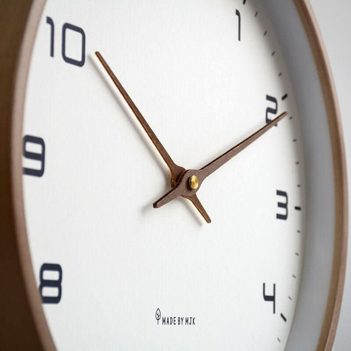 Nordic style silent wooden wall clock, perfect for modern home decor. Adds warmth to any room.