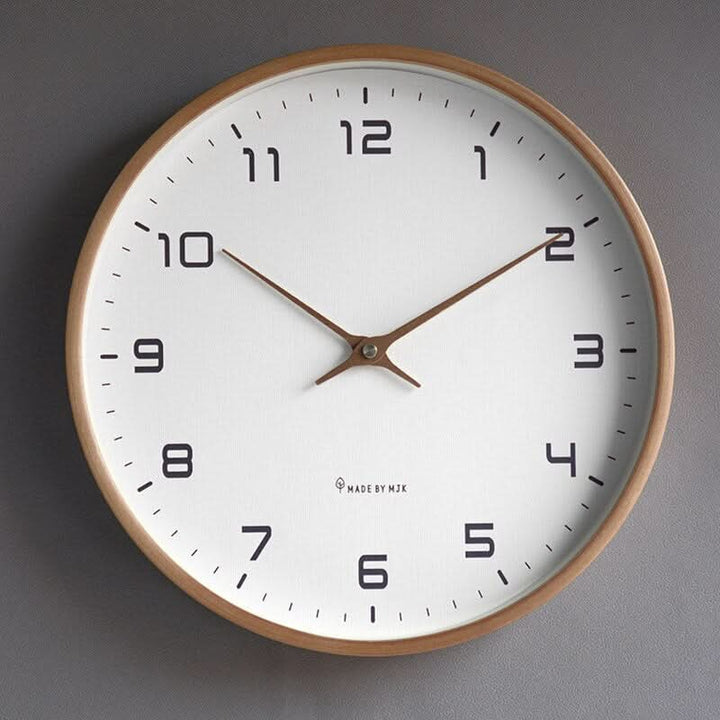 Minimalist silent wooden wall clock. Scandinavian design, natural wood, ideal for living room decor.