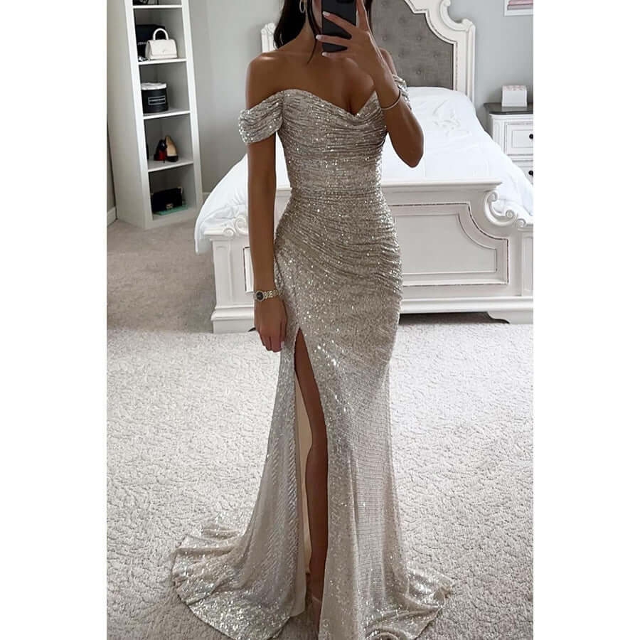 Glamorous women's sequin off-shoulder evening gown with a high thigh slit, perfect for formal events. [[lstfy-media:1]]