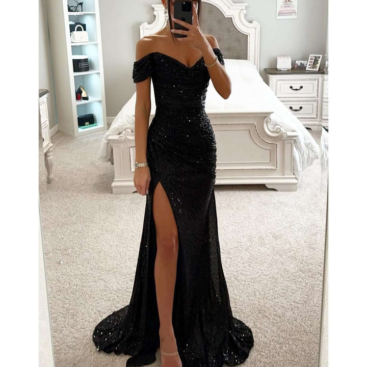 Stunning women's sequin party dress with off-shoulder design, a flattering thigh slit, and shimmering fabric. [[lstfy-media:3]]