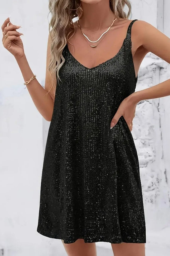 Stylish women's sequin mini party dress with a flattering v-neck, perfect for evening.