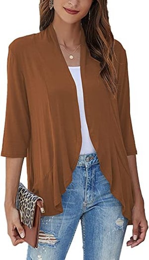 Modern women's draped open front cardigan featuring a flowy silhouette & practical 3/4 sleeves.