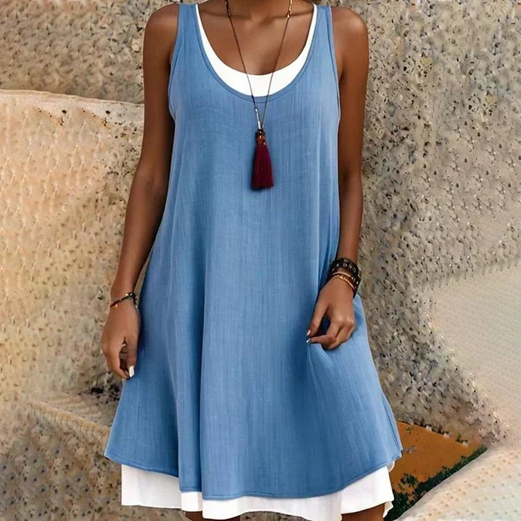 Versatile women's faux two-piece sleeveless mini dress. A chic layered casual day dress for summer.