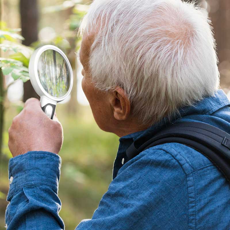 Handheld LED magnifying glass for clear, illuminated reading. Great for low vision & hobbies.