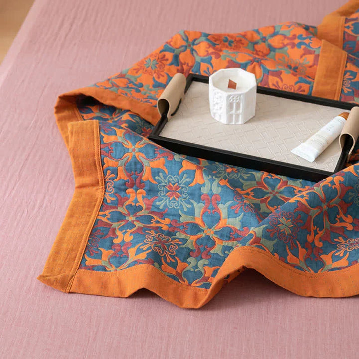 TerraLoom's orange & blue patterned six-layer cotton quilt, offering cozy comfort and stylish home decor.