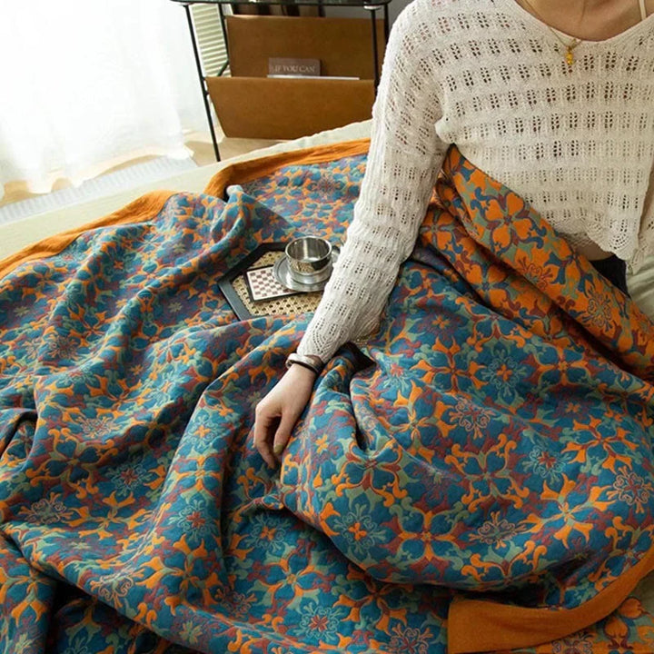 Soft six-layer cotton quilt featuring a stylish orange & blue pattern, perfect for cozy bedroom bedding.