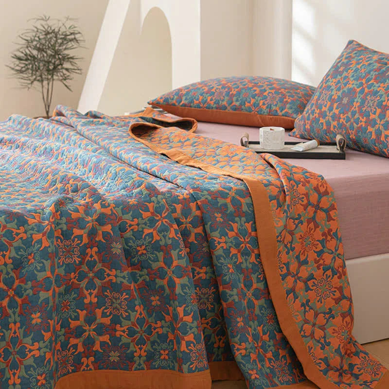 TerraLoom six-layer cotton quilt in an eye-catching orange & blue pattern, breathable and cozy bedding.