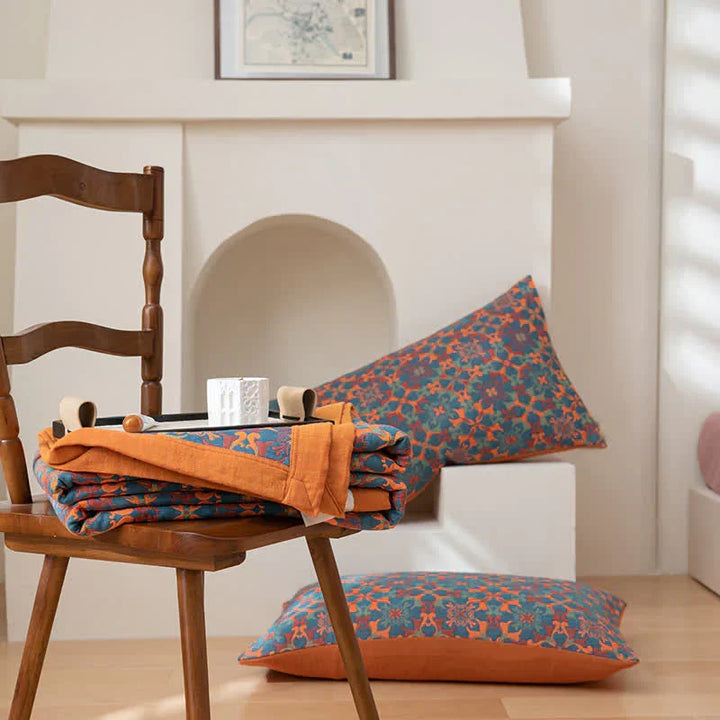 Decorative orange and blue patterned six-layer cotton quilt, adding comfort and style to home decor.