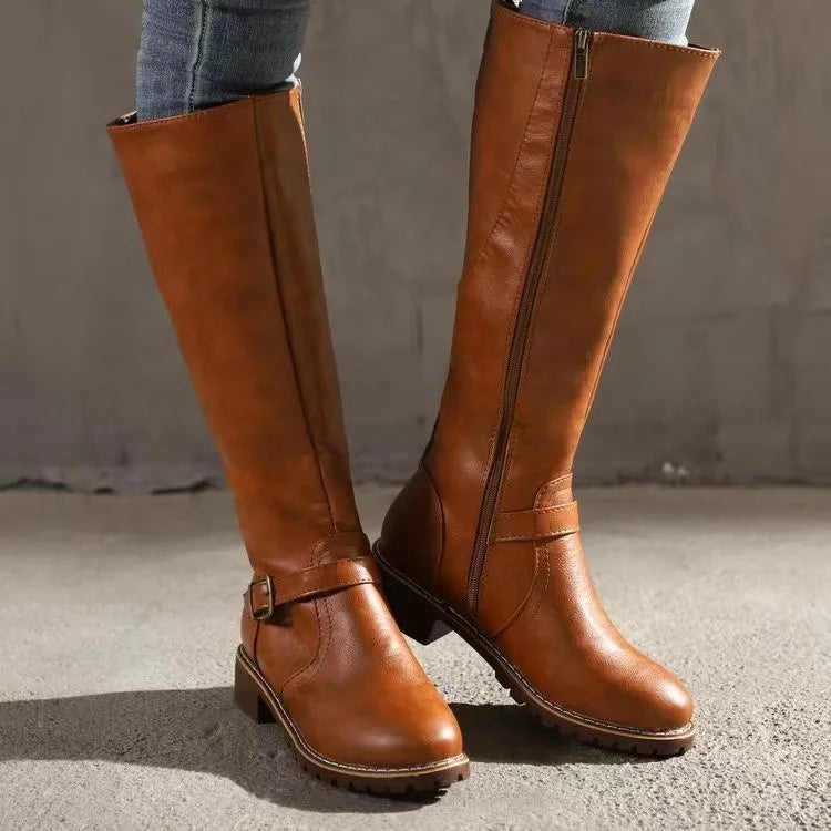 Women's black orthopedic buckle boots offering all-day comfort, arch support, and stylish fall/winter footwear.