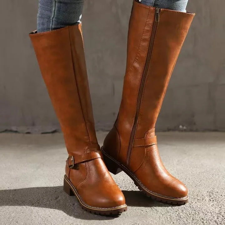 Women's black orthopedic buckle boots offering all-day comfort, arch support, and stylish fall/winter footwear.