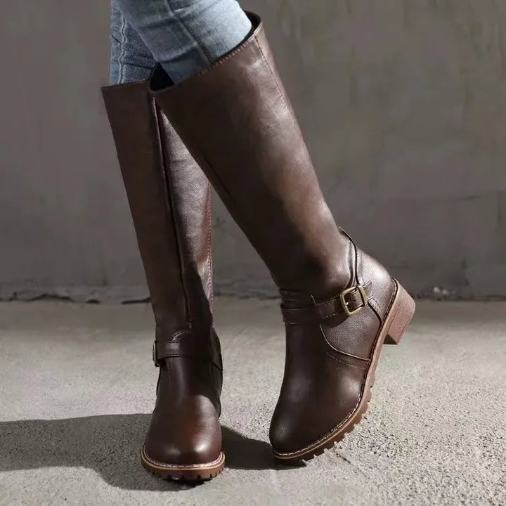 Durable women's orthopedic boots featuring decorative buckles & side zipper, ensuring arch support & comfy steps.