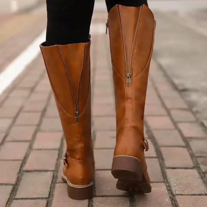 Modern women's buckle boots designed with orthopedic arch support for superior comfort and versatile winter style.