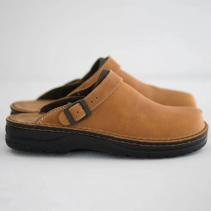 Black men's orthopedic clogs with slip-resistant sole, lightweight design for work comfort & daily support.