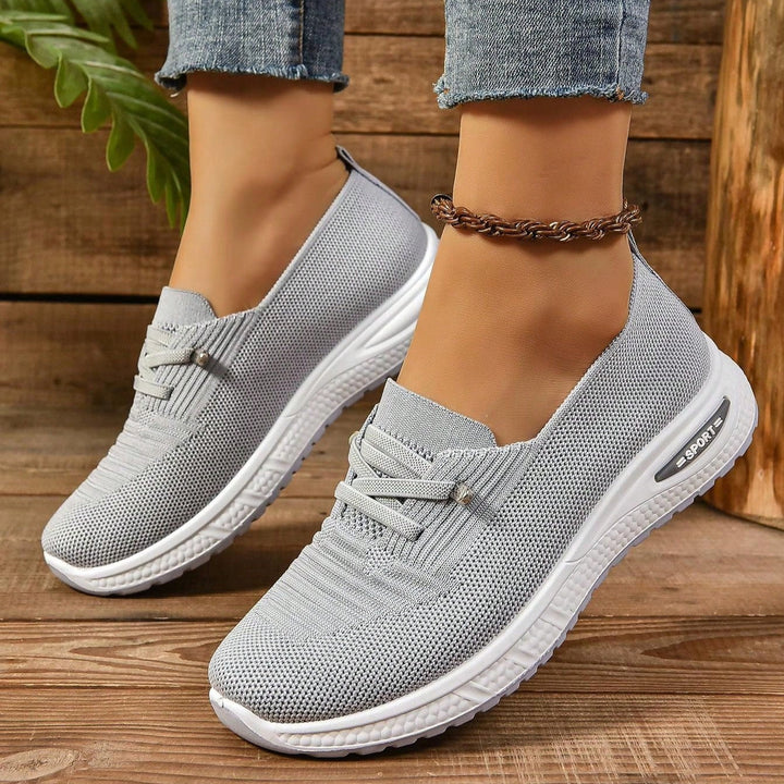 Women's supportive orthopedic sneakers, ideal for walking, sports & daily wear, offering cushioned comfort.