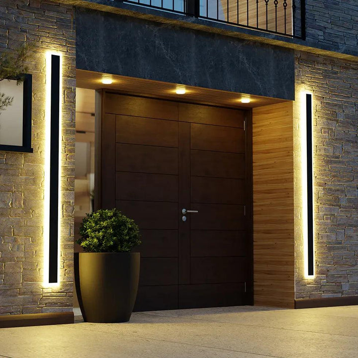 Modern outdoor LED wall light, sleek design for patio & garden illumination. Energy-efficient exterior facade lighting.