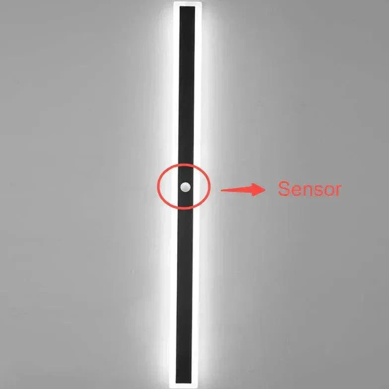 Sleek black modern LED wall light for bright outdoor patio & garden lighting. Stylish facade illumination.
