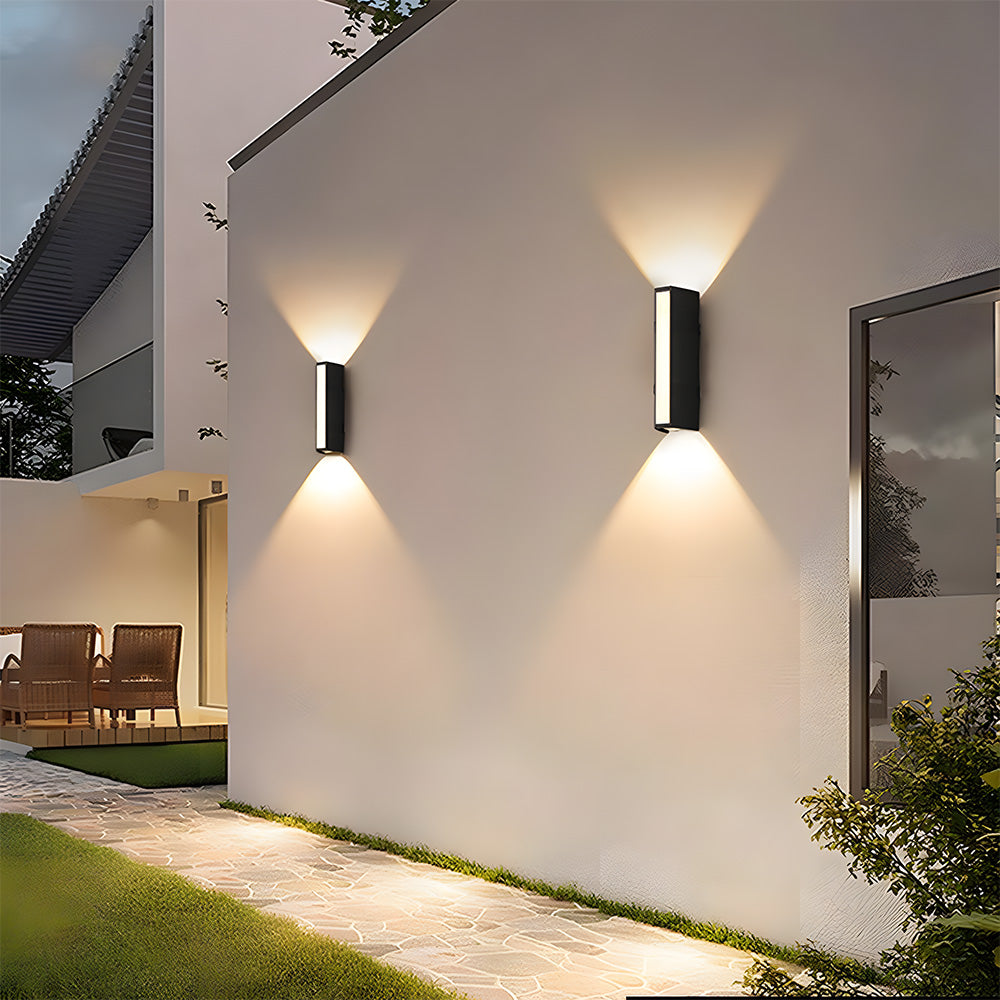 Modern architectural black LED outdoor wall sconce enhances home decor.