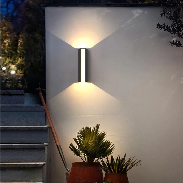 Sleek, waterproof black LED wall fixture; perfect for modern outdoor lighting.